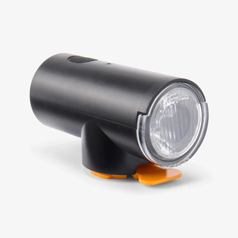Feu avant vélo Decathlon FL510 : phare noir cylindrique à lentille ronde et fixation orange