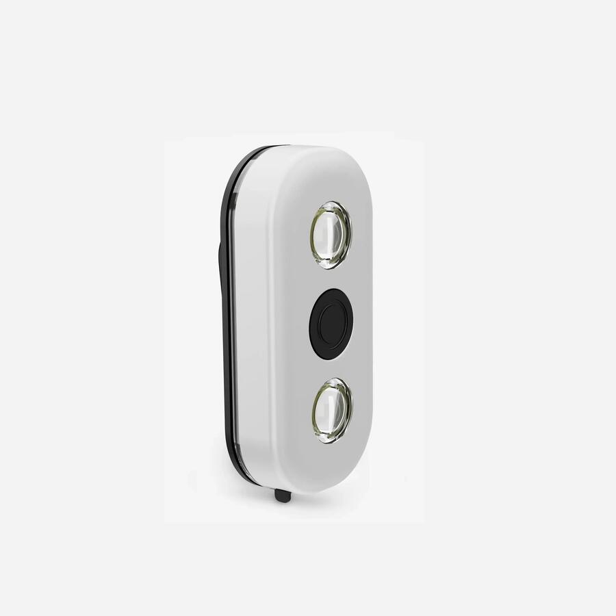 Lumière de visibilité Decathlon CL900 : boîtier blanc ovale avec deux LED et un bouton central