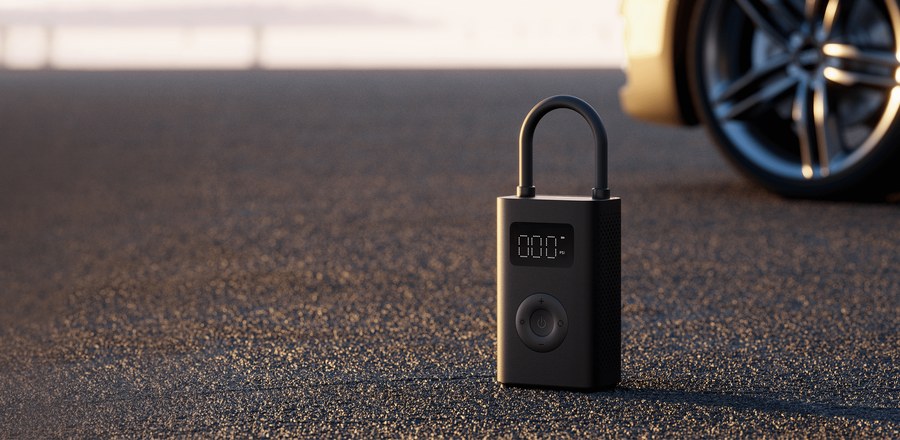 Compresseur d'air électrique portable Xiaomi 2 posé sur le sol, utilisable pour les pneus de vélo